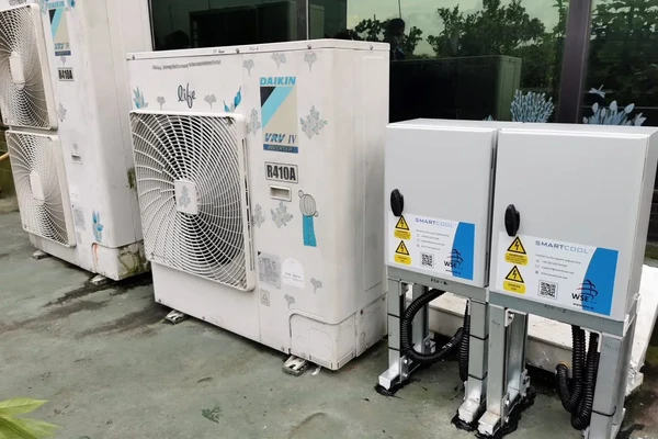 ECO3 weatherproof enclosure mounted alongside commercial AC outdoor units
