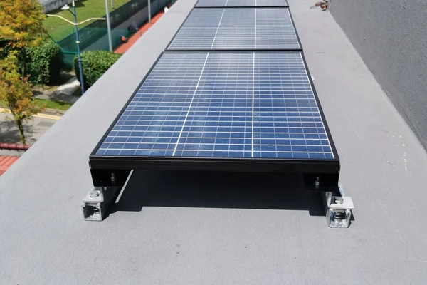 Solar fan installation in industrial warehouse space